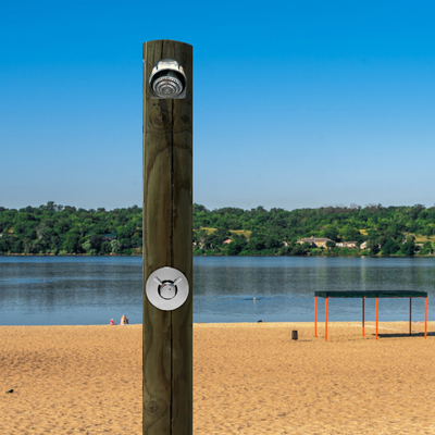 outdoor time and temperature adjustable shower valve and anti-ligature shower head at a public beach