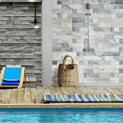 outdoor exposed pool shower valve with anti-ligature shower head at a resort/ hotel main